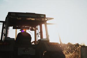 Australian farmer on tractor working on his field