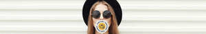 Woman with sunglasses and wide brim hat holding Pretty Green logo