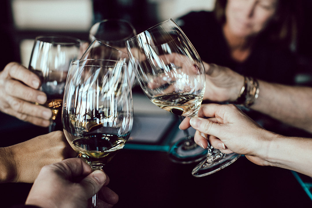 Toasting with wine glasses during friday drinks