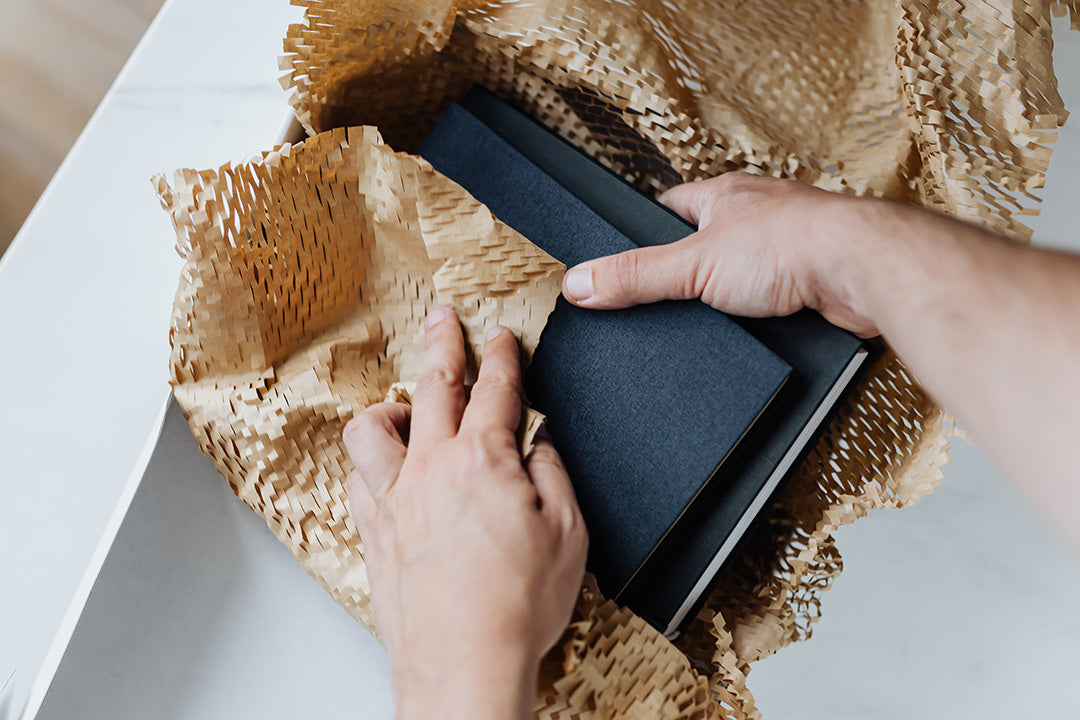 Unwrapping onboarding gift of notebooks