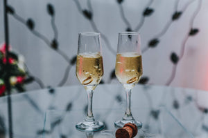 Champagne glasses with wedding rings